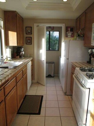 Kitchen with Recessed Lighting and Attached Laundr