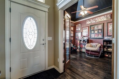 Entrance foyer featuring dark wood-type flooring, 