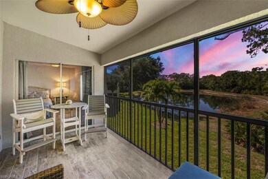 Sunroom with a ceiling fan and a water view