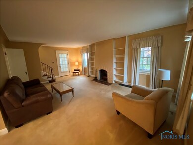 COVED CEILINGS AND A VIEW FROM THE ENTRANCE WAY. B