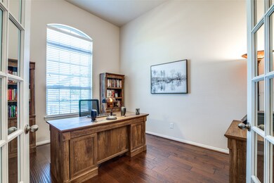 Dedicated study/office with French doors and engineered wood floors.  Study overlooks the front yard.