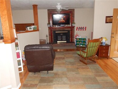 Living room, fireplace, open to kitchen