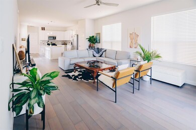 Living room with light wood-type flooring and a c