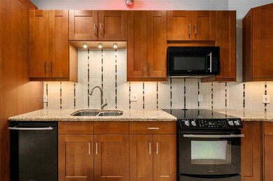 This spacious kitchen features warm wooden cabinet
