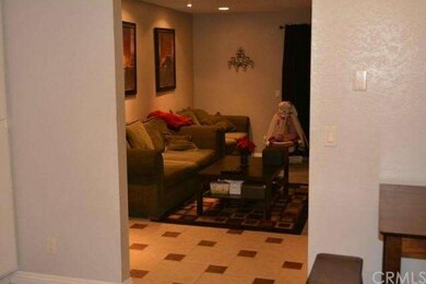 View from kitchen into family room, bedrooms to th