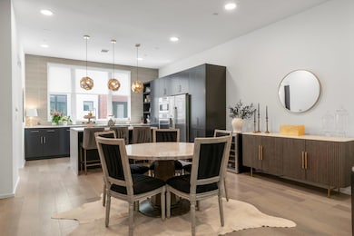 Dining room featuring light wood finished floors 