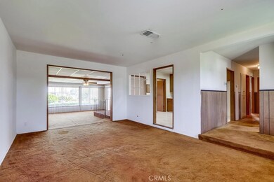 living room opens to bonus room