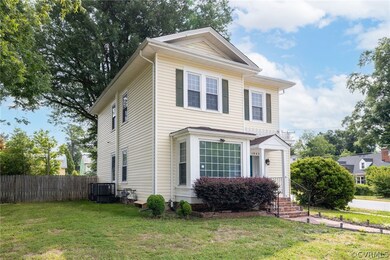 View of front of house featuring central AC and a