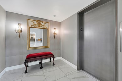 Elegant hallway with modern lighting and neutral tones, creating a warm transition between spaces.