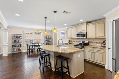 Updated kitchen featuring a farmhouse sink, large