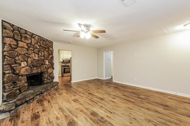 Unfurnished living room with hardwood / wood-style