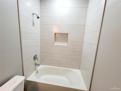 Full bathroom featuring toilet and bathtub / shower combination