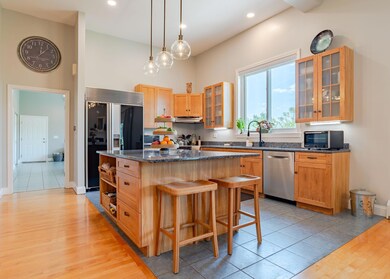 Kitchen looking into expansive Mudroom