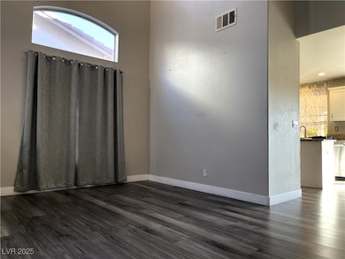 Dining room featuring dark wood-style floors, base