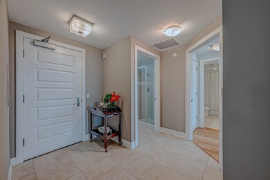 Welcoming entry with elegant custom tile and seaml