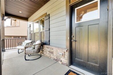 Doorway to property with covered porch