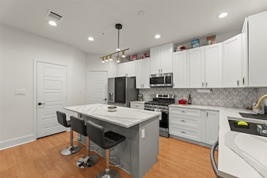 Matching black and stainless steel appliances.