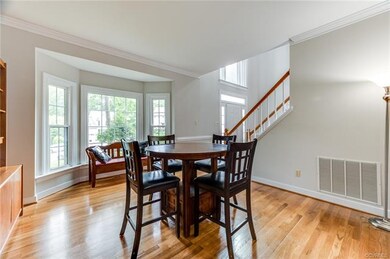 Gracious living room with large bay window and lot