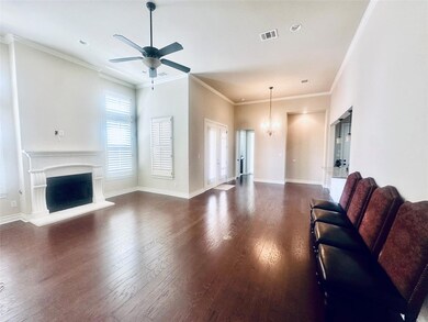 Living room featuring wood-type flooring, a ceili