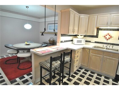 View of breakfast bar in kitchen which also makes 