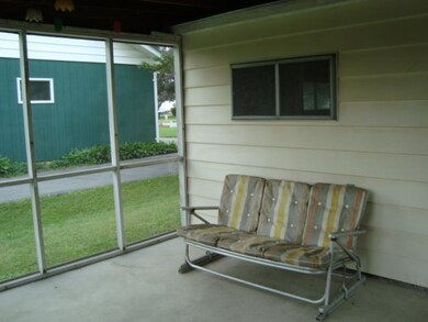 Exterior Back 2nd view of sun porch area to enjoy 