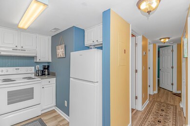 Kitchen with light hardwood / wood-style flooring,