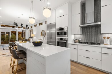 Kitchen with wall chimney range hood, a kitchen i