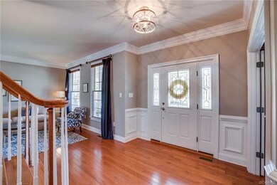 Inviting Foyer with decorative front door and side