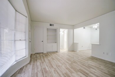 Spacious living room with built-in bookcase and a