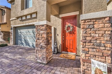 View of exterior entry featuring stucco siding, an