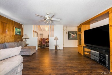 View from bonus room door across living room to dining room.