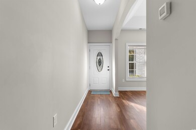 Foyer with wood-type flooring