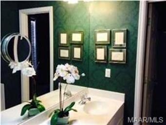 Large master bath with two sinks and a separate ga