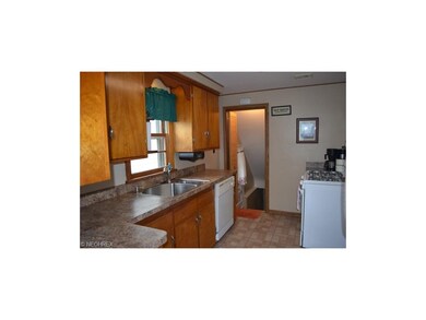 Updated kitchen with all appliances, mud room and laundry area.