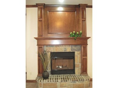 Living Room. Wood burning fireplace is a work or a