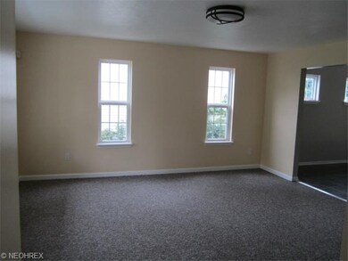 Living Room view from front door. Slight view of dining room