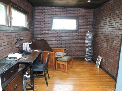 Bedroom 3  With Red Brick Paneling and Dual Pain W
