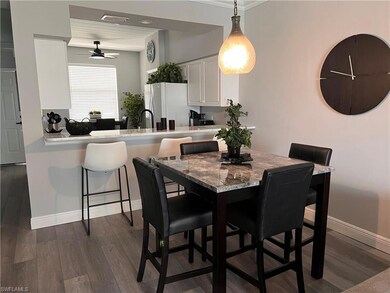 Dining space featuring dark wood-type flooring, ce