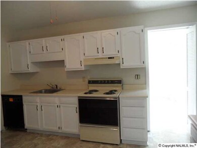 Kitchen with lots of cabinets and counter tops