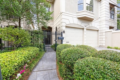 Pristine landscaping and a paver walk-way greet you as you enter the property.