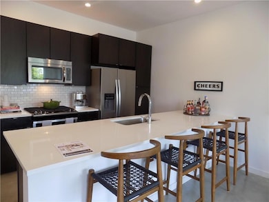 Kitchen featuring appliances with stainless steel
