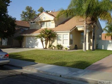 Front view of the home with vinyl fencing on the r