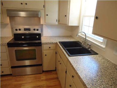 Kitchen is large with area for a table and chairs