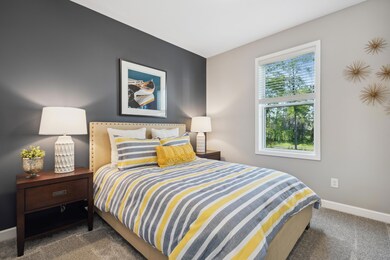 (Photo of a decorated model, actual homes finishes will vary) The main level has a guest suite which makes this home have 5 bedrooms and 4 baths.