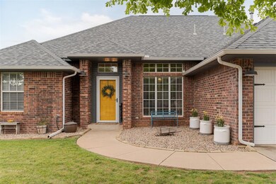 View of exterior entry with a lawn