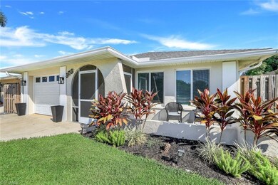 Front view of property featuring an outdoor front 