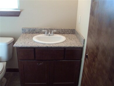 both bathroom vanities have granite counter tops