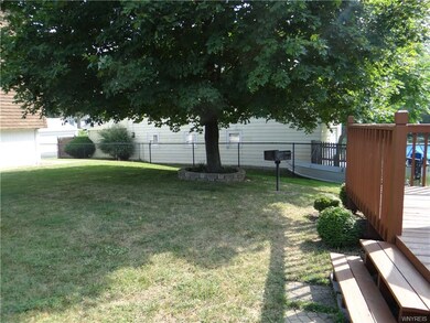 Shady yard for backyard get togethers includes a c