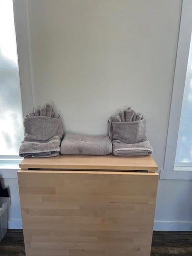 Detailed view of wood finished floors and vanity