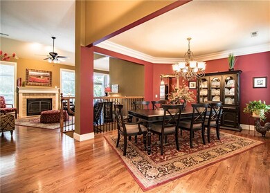 There is enough room for an 8 person table in the elegant formal dining room.